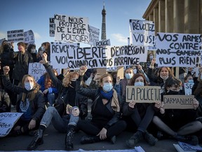 Protestors demonstrate against the French Government's newly passed Global Security law bill at Place du Trocadéro on Saturday in Paris, France.