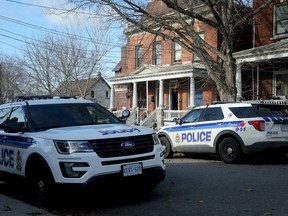 Police cars at the scene after a stabbing death at 11-13 Eccles Street.