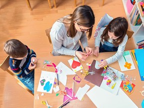 FILE: A teacher working with young children.