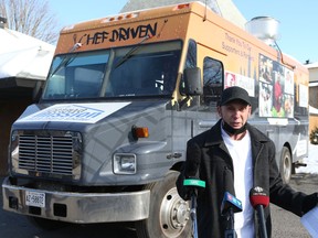 Chef Ric Allen-Watson, director of food services for The Ottawa Mission, in front of the food trucks that rolls around the city delivering about 2,000 meals a week.