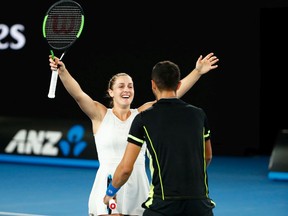 Gabriela Dabrowski of Ottawa and Mate Pavic of Croatia celebrate after winning the mixed doubles final against Rohan Bopanna of India and Timea Babos of Hungary in the 2018 Australian Open at Melbourne.