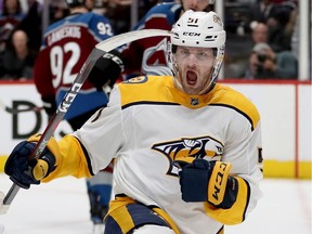 Austin Watson celebrates scoring a goal when he played for the Nashville Predators in a game against the Colorado Avalanche on April 22, 2018 in Denver, Colorado.