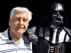 This photo taken on April 27, 2013 during a Star Wars convention in Cusset, central France, shows David Prowse, the British actor behind the menacing black mask of Star Wars villain Darth Vader, who died aged 85 his agent said on November 29, 2020.