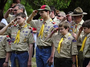 Members of the Boy Scouts salute during the raising of the flag in this May 25, 2009 file photo in Hudson, Wisconsin during Memorial Day ceremonies. PHOTO BY KAREN BLEIER/AFP via Getty Images.