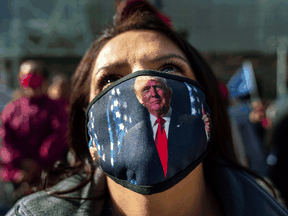 Trump supporter Teresa Rorick attends a protest against the U.S. election results outside the central counting board at the TCF Center in Detroit.