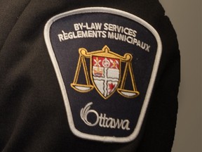 Ottawa bylaw officers have issued more than $1,000 in fines to the owner of the dog that bit two men in Vanier on Saturday.