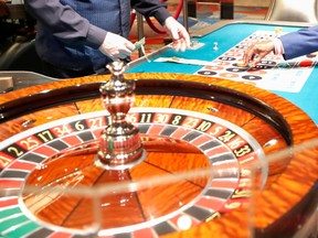 FILE: Placing a bet at a roulette table.