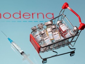 A small shopping basket filled with vials labeled "COVID-19 - Coronavirus Vaccine" and a medical syringe are placed on a Moderna logo in this illustration taken November 29, 2020.