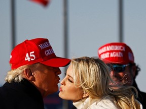 U.S. President Donald Trump kisses his daughter Ivanka at the end of a campaign rally at Dubuque Regional Airport in Iowa, U.S., November 1, 2020.