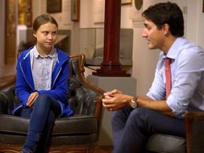 Prime Minister Justin Trudeau greets Swedish climate activist Greta Thunberg in Montreal on Sept. 27, 2019.