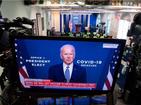 U.S. President-elect Joe Biden appears on a television screen in the press room of the White House in Washington Nov. 9 as he speaks about coronavirus.