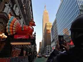 People enjoy the Thanksgiving decorations at Macy's Herald Square store in New York City on Nov. 24.