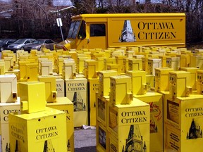 A collection of Ottawa Citizen newspaper boxes in the newspaper's parking lot, 2009.