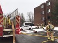 Firefighters at scene of an apartment fire Thursday at 1720 Baseline Rd.