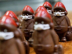 Chocolate Santas wearing protective face masks are seen in the workshop of the Hungarian confectioner Laszlo Rimoczi, during the coronavirus disease (COVID-19) outbreak in Lajosmizse, Hungary, November 20, 2020.