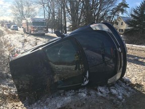 OTTAWA- November 23, 2020. Firefighters free driver after compact car rolls over in ditch in Vars.
