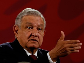 Mexico's President Andres Manuel Lopez Obrador gestures during a news conference at National Palace in downtown Mexico City, Mexico November 13, 2020.