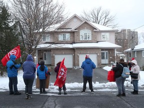 ACORN protesting near mayor Jim Watson's driveway in Ottawa on Tuesday.