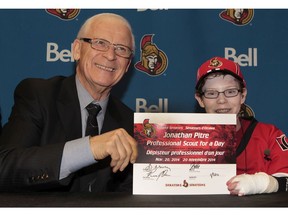 Ottawa Senators General Manager Bryan Murray announced a new addition of Jonathan Pitre (14) to the team's scouting staff in Ottawa Thursday Nov 20,  2014. Jonathan signed a one day ceremonial contract with the club Tuesday.  Tony Caldwell/Ottawa Sun/QMI Agency