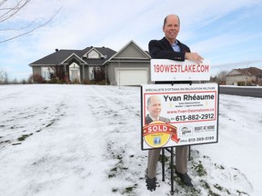 Real estate agent Yvan Rhéaume poses for a photo at 190 West Lake Circle. The home sold for $1.2 million, about $250,000 over the initial asking price.