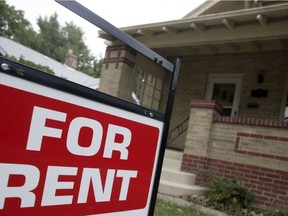 A for rent sign in front of a rental property.