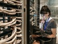 A Nokia employee in Kanata works on 5G networking gear. Nokia's multi-year transformation paid off last year as company shares surged 59 per cent.