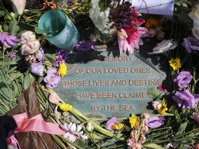 Files: Flowers are laid at a memorial for persons lost at sea, at Santa Barbara Harbor, on September 4, 2019 in Santa Barbara, California. Authorities announced that the bodies of 33 victims had been recovered after the commercial dive ship Conception caught fire and later sank, while anchored near Santa Cruz Island.