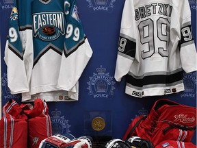 Brantford police have laid charges against two people, including an OPP inspector,  after the theft of Wayne Gretzky sports memorabilia from the home of Walter Gretzky.