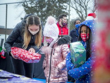 The goal of Saturday's event, Prezdential Basketball's Manock Lual said, was to make Christmas a little brighter for families with children.