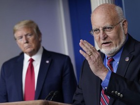 Dr. Robert Redfield, Director of the Centers for Disease Control and Prevention speaks while U.S. President Donald Trump listens during the daily briefing of the coronavirus task force at the White House on April 22, 2020.