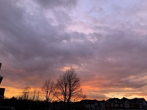 The sky over Ottawa glows as the sun rises on Christmas Eve morning, ahead of wet weather.