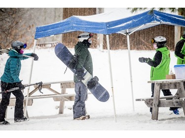 Skiers and snowboarders were out, socially distanced, enjoying a bit of fresh snow at Camp Fortune on Monday.