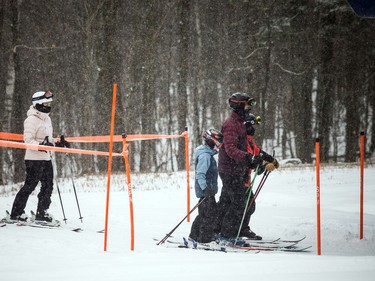 Skiers and snowboarders were out, socially distanced, enjoying a bit of fresh snow at Camp Fortune on Monday.
