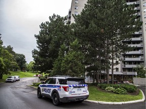 In this file photo from 2020, police are pictured at the Richmond Road apartment building where Jonathan Wite was killed.