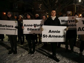 Remember their names: People gather at the Women's Monument at Minto Park on Dec. 6, 2019 to mourn the lost lives from the massacre at l'Ecole Polytechnique in Montreal where 14 women were killed in 1989.