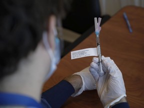 A file photo of the use of the Pfizer-BioNTech's COVID-19 vaccine at The Ottawa Hospital.