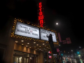 On Christmas Eve, the ByTowne Cinema closed its doors for possibly the last time. Here, Phil Graham leaves a thank-you message on the theatre's marquee.