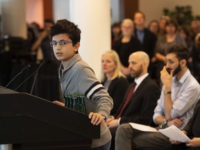 Ryan Pourjam, 13, son of Mansour Pourjam, speaks about his father during a ceremony at Carleton University. Mansour Pourjam died in the Jan. 8 crash of an airliner, shot down over Tehran.