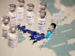 Vials labelled "COVID-19 Coronavirus-Vaccine" and medical syringe are placed on the European Union map in this picture illustration taken December 2, 2020.