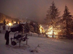 Snowmaker Guy Arnaud checks a snow making machine during his shift, before the official opening of the Alpine ski resort of Verbier on December 5, amid the coronavirus disease (COVID-19) outbreak, in Verbier, Switzerland December 1, 2020.