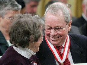 Files:  Former Toronto Mayor David Crombie of Toronto, (right) lafter receiving the Order of Canada during a ceremony at Rideau Hall in Ottawa Friday, March 11, 2005. A former Conservative federal cabinet minister and Toronto mayor has stepped down as head of Ontario's Greenbelt Council in protest over proposed rules he says would gut environmental protections in the province.
