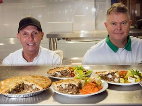 Executive chef Ric Watson (left), director of Food Services at The Ottawa Mission, and corporate executive chef Alain Bellemare of Green Valley Canada displaying tourtières made with Green Valley’s plant-based alternative.