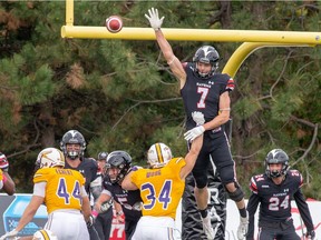 Jay Dearborn, while with the Carleton Ravens, tries to block an attempted field goal. Injured in a 2019 CFL pre-season game, Dearborn thought his football career might be over. A lot has changed since then.