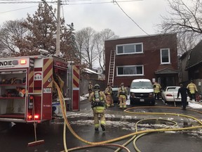 Firefighters battle a fire in an apartment at 72 St Francis St. near Gladstone and Parkdale.