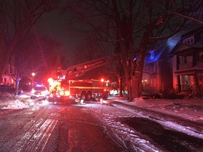 Ottawa firefighters battle a blaze on Powell Avenue on Sunday, Dec. 20, 2020.