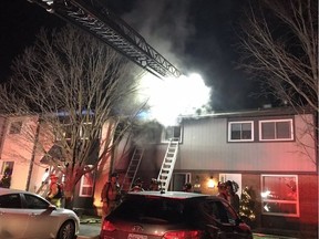 Ottawa firefighters at the scene of a fire at 6 Spring Grove Lane on Tuesday, Dec. 15, 2020.
