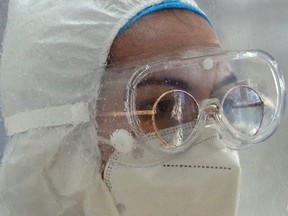 FILE: A health worker wearing a protective suit amid the coronavirus pandemic.