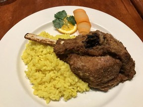 Veal chop milanese with saffron risotto at Del Piacere,