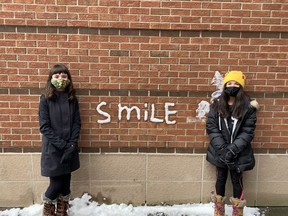 Students at St. Mother Teresa High School celebrated the arrival of snow in November by using it to create a message on the outside of the school.