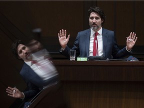 Prime Minister Justin Trudeau gestures as he responds to a question during a year end interview with the Canadian Press.